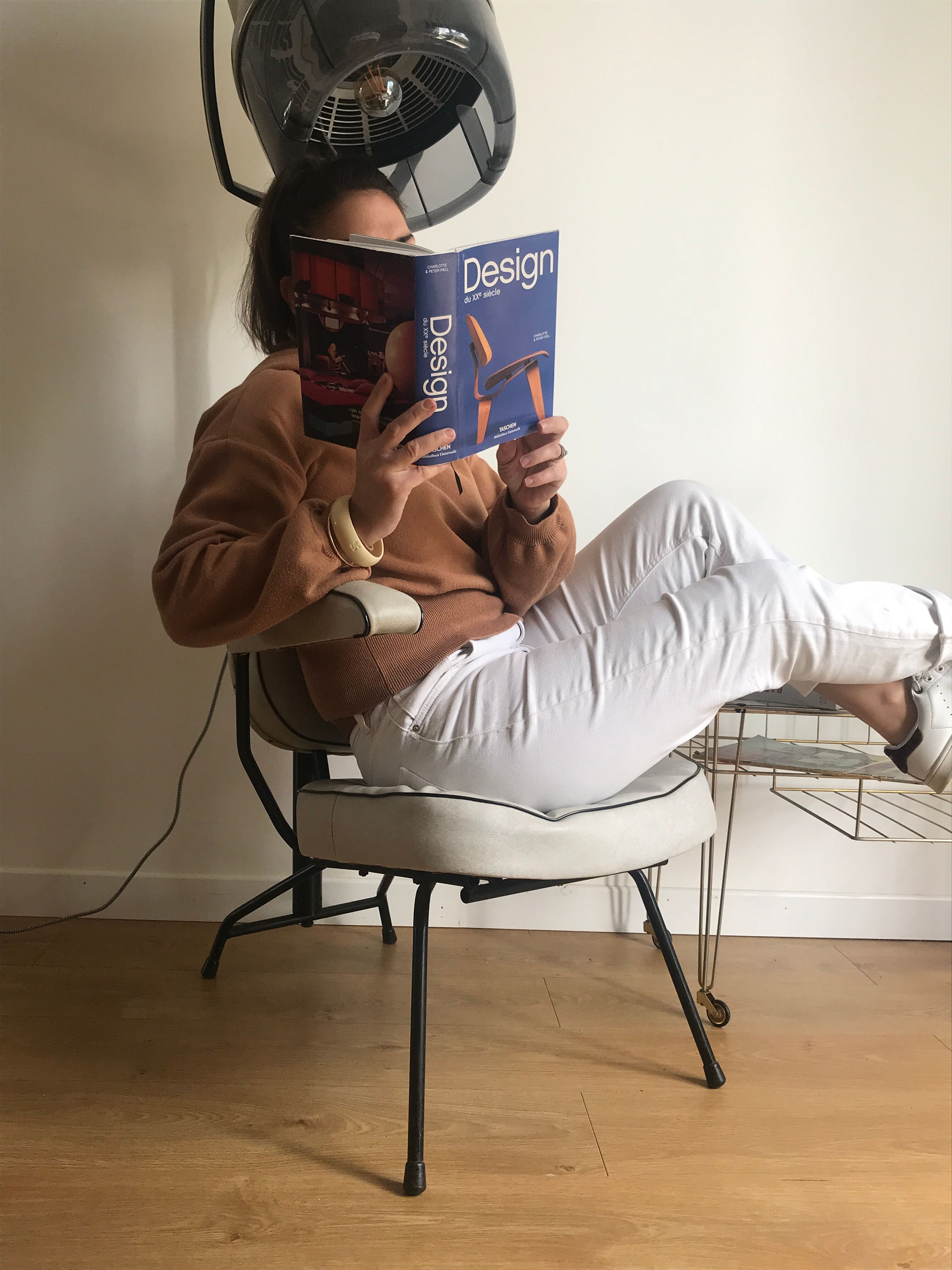 Vintage hairdresser's armchair with helmet transformed into a lamp