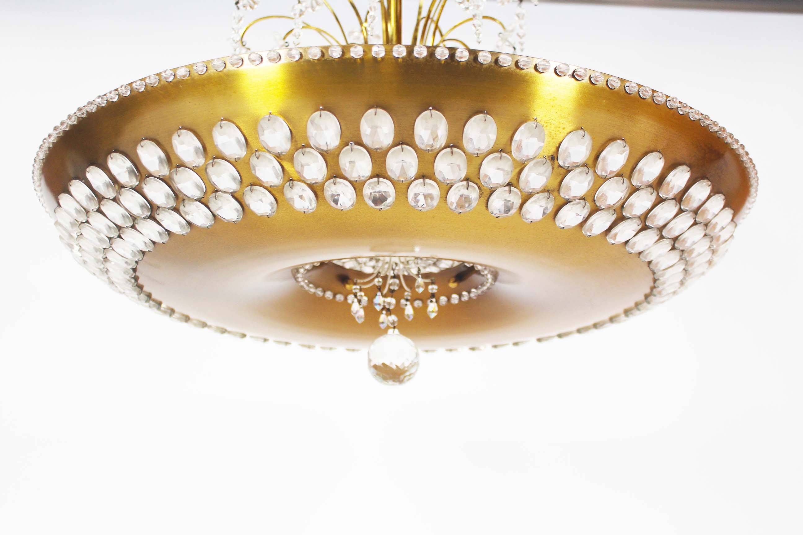 Monumental brass and crystal chandelier from Palwa