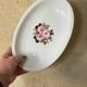 2 oval porcelain dishes with a floral pattern