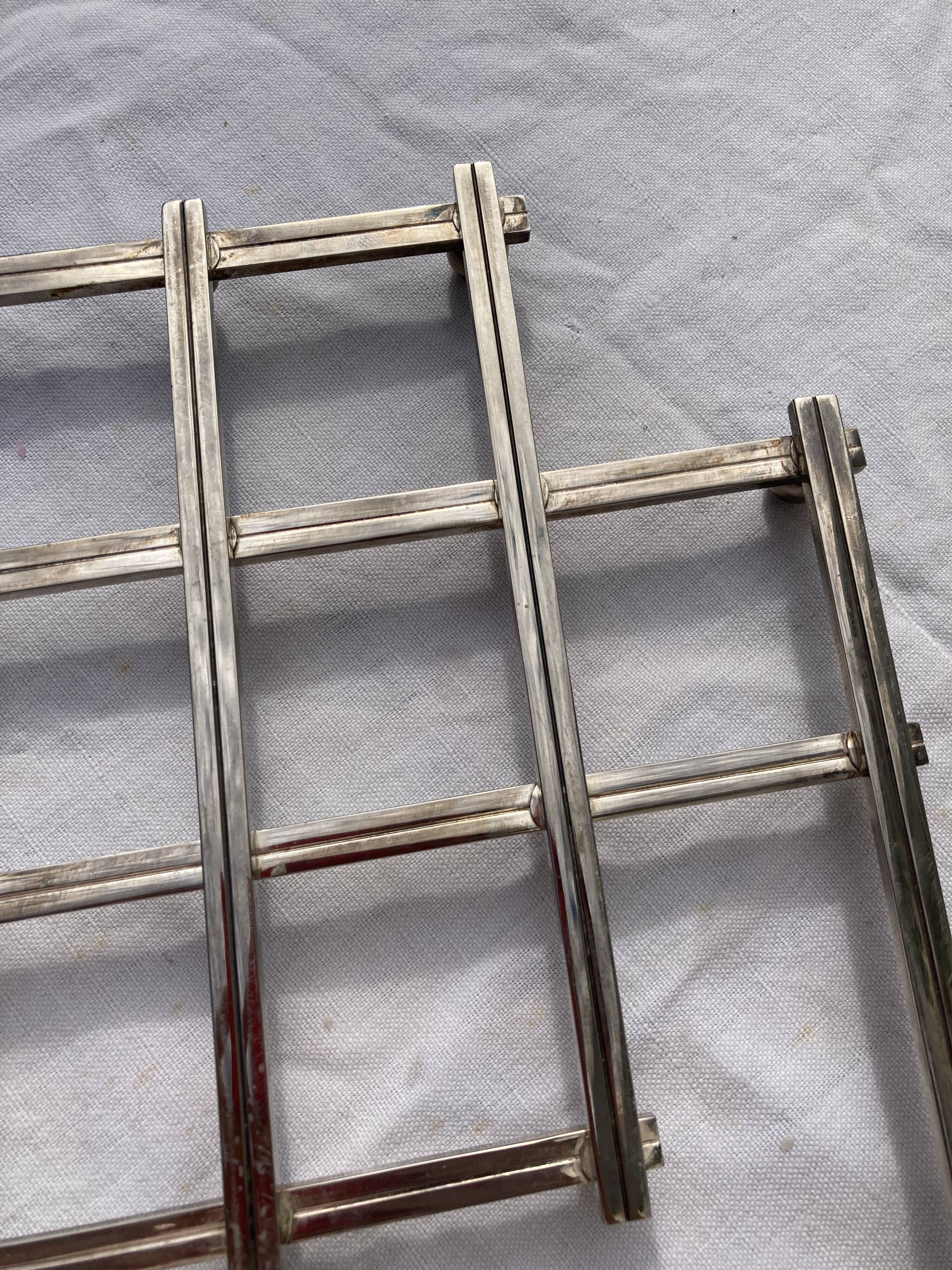 Stretch trivets in silver metal, geometric shapes