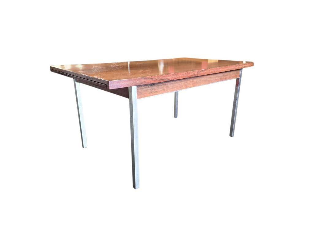 Vintage wooden dining table with chrome frame.