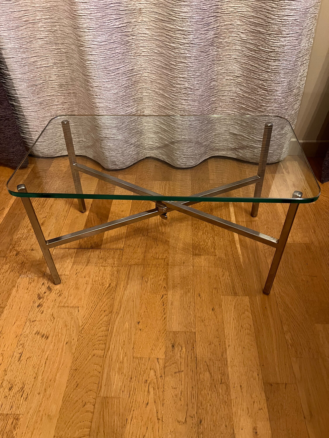 Small chrome and glass coffee table.