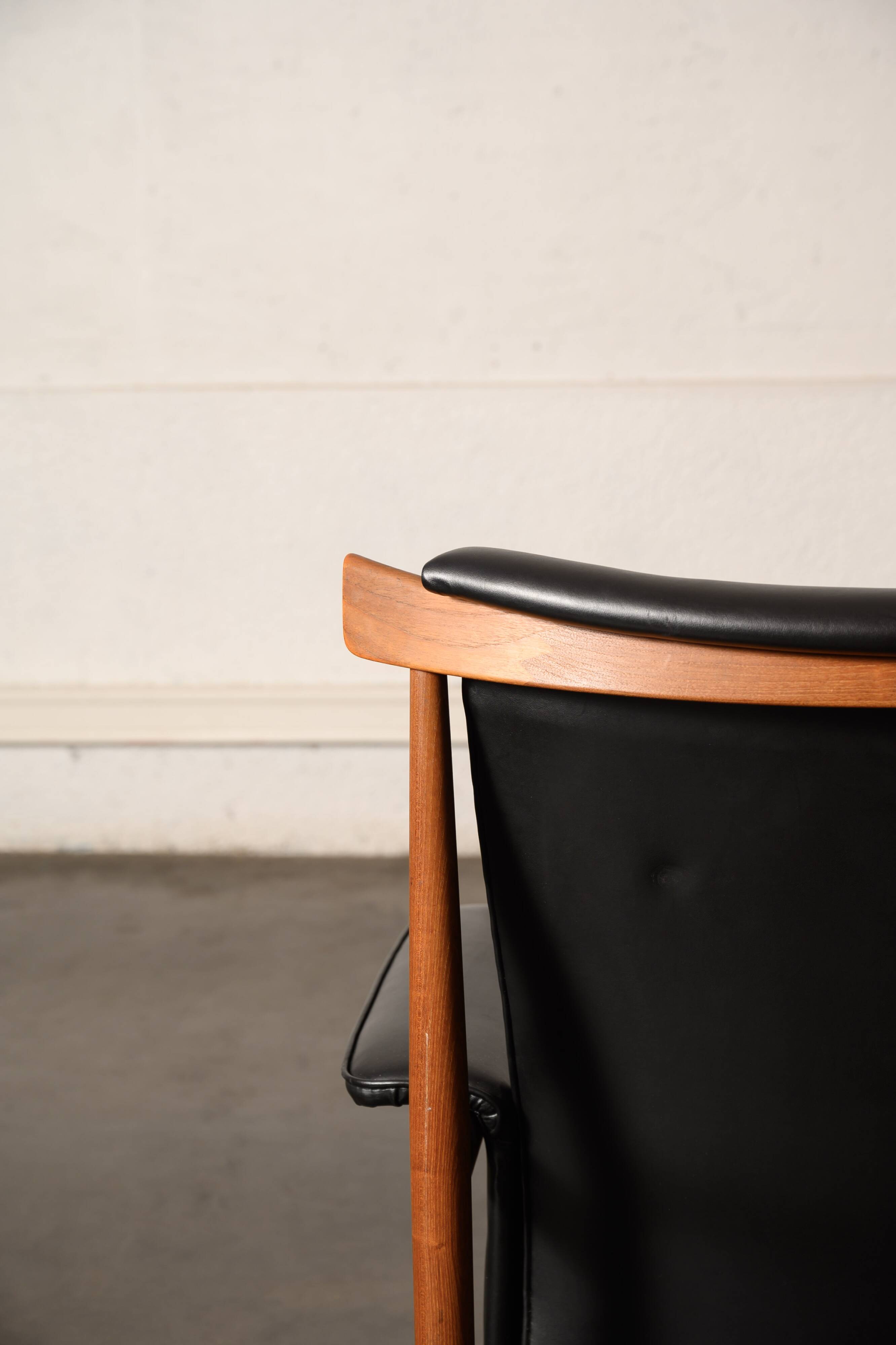 Finished Juhl armchair and its ottoman.