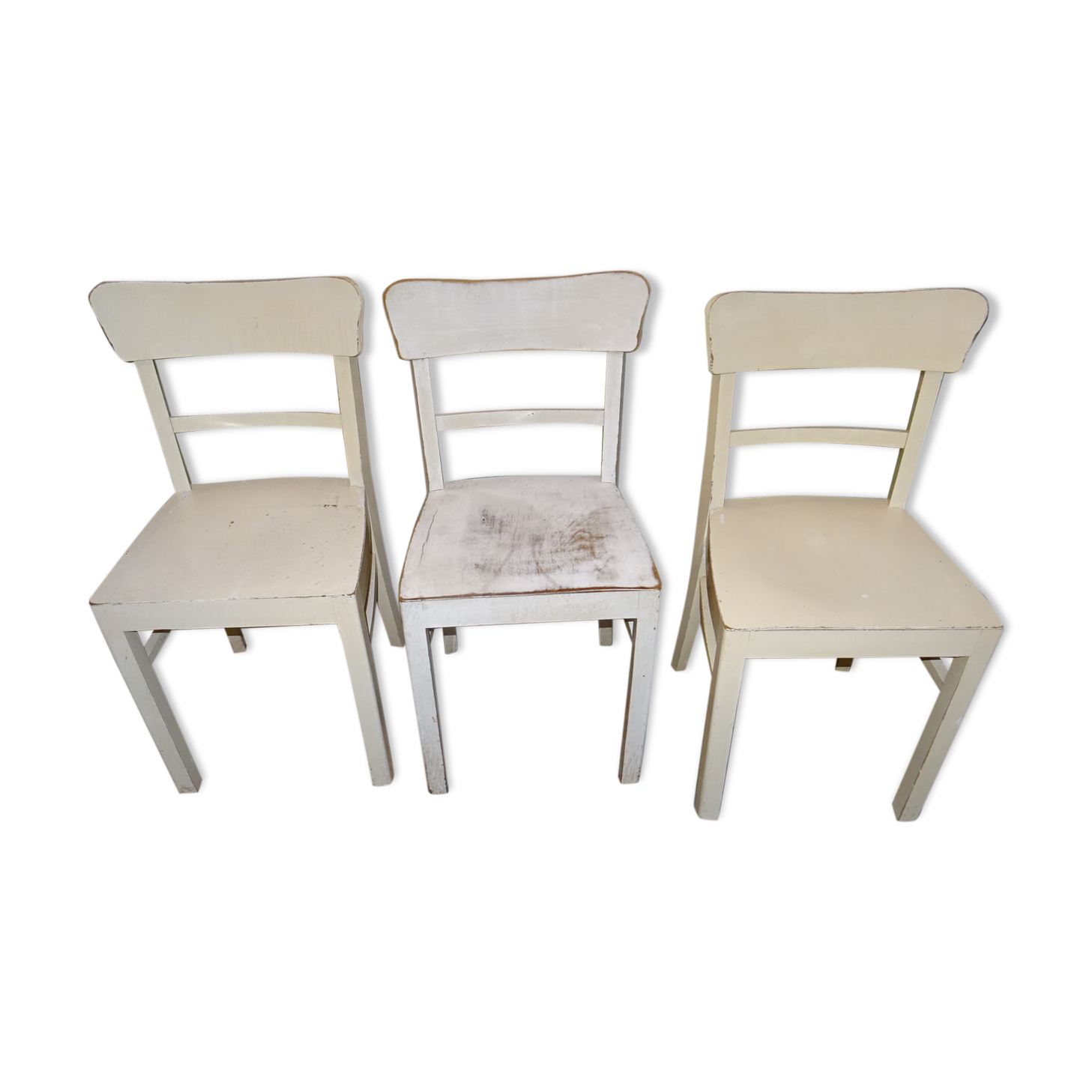 3 white chairs