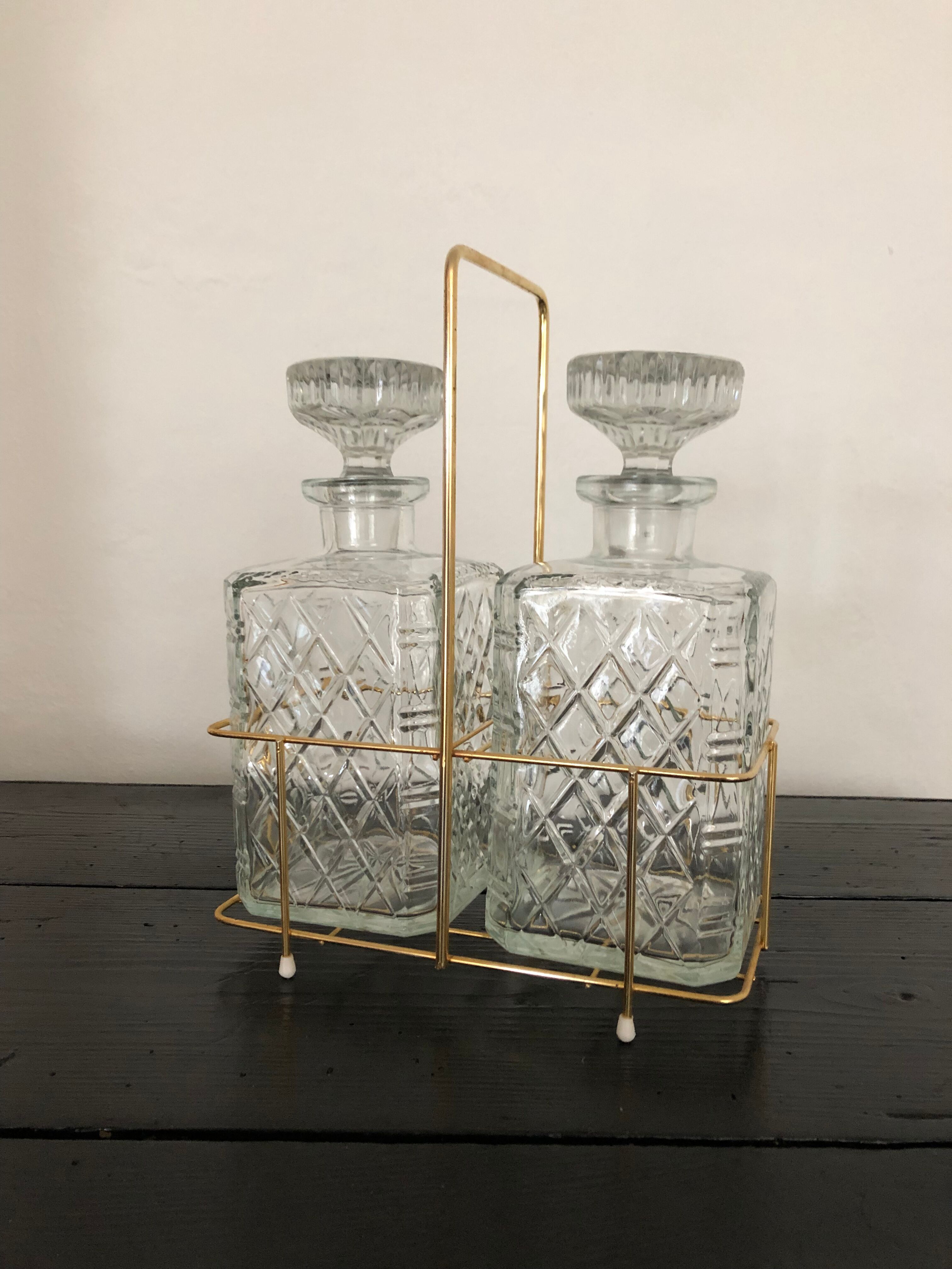 Pair of vintage decanters with brass basket