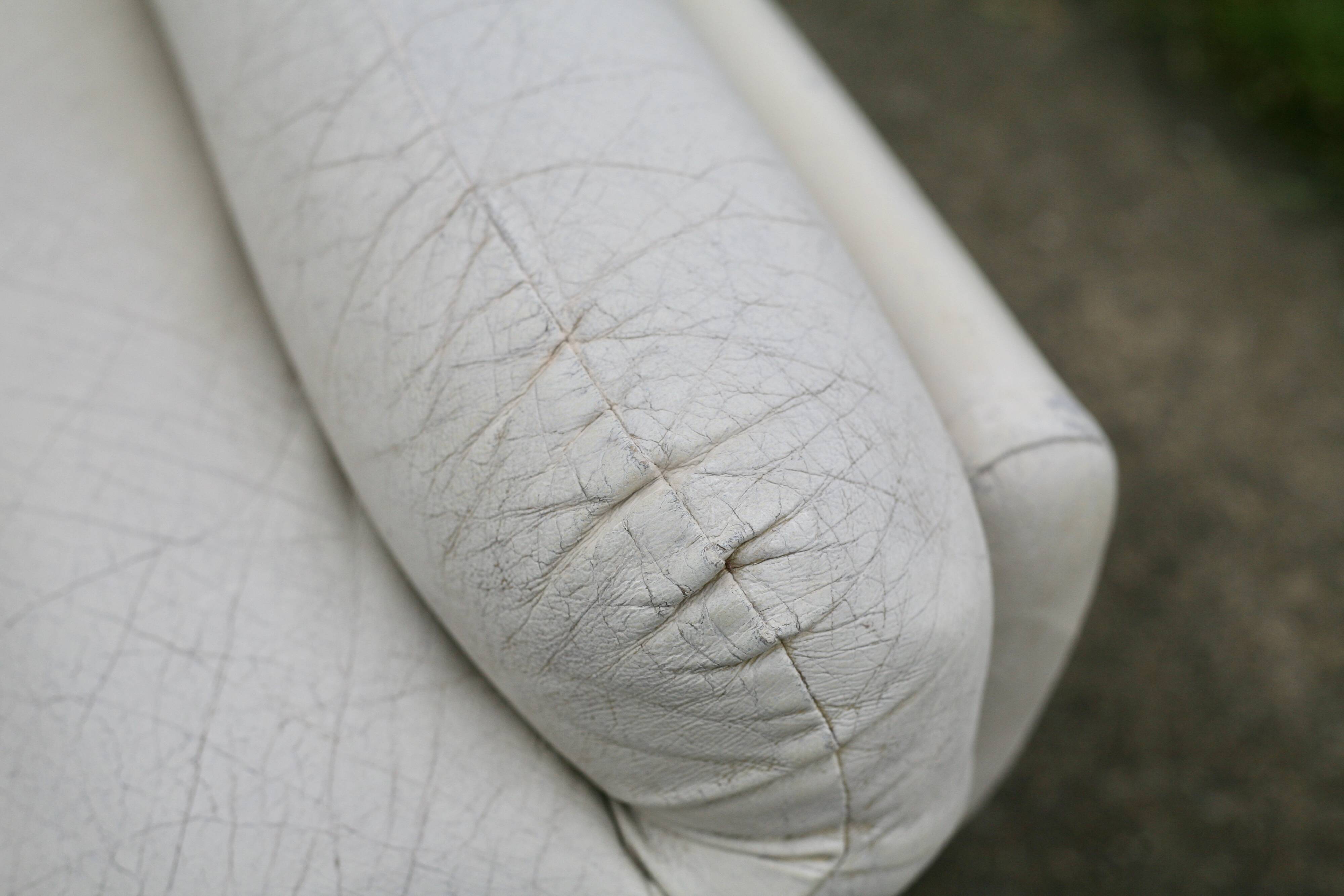 Pair of leather “space age” armchairs. Cream colour". Circa 1970.