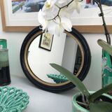 black and gold oval mirror