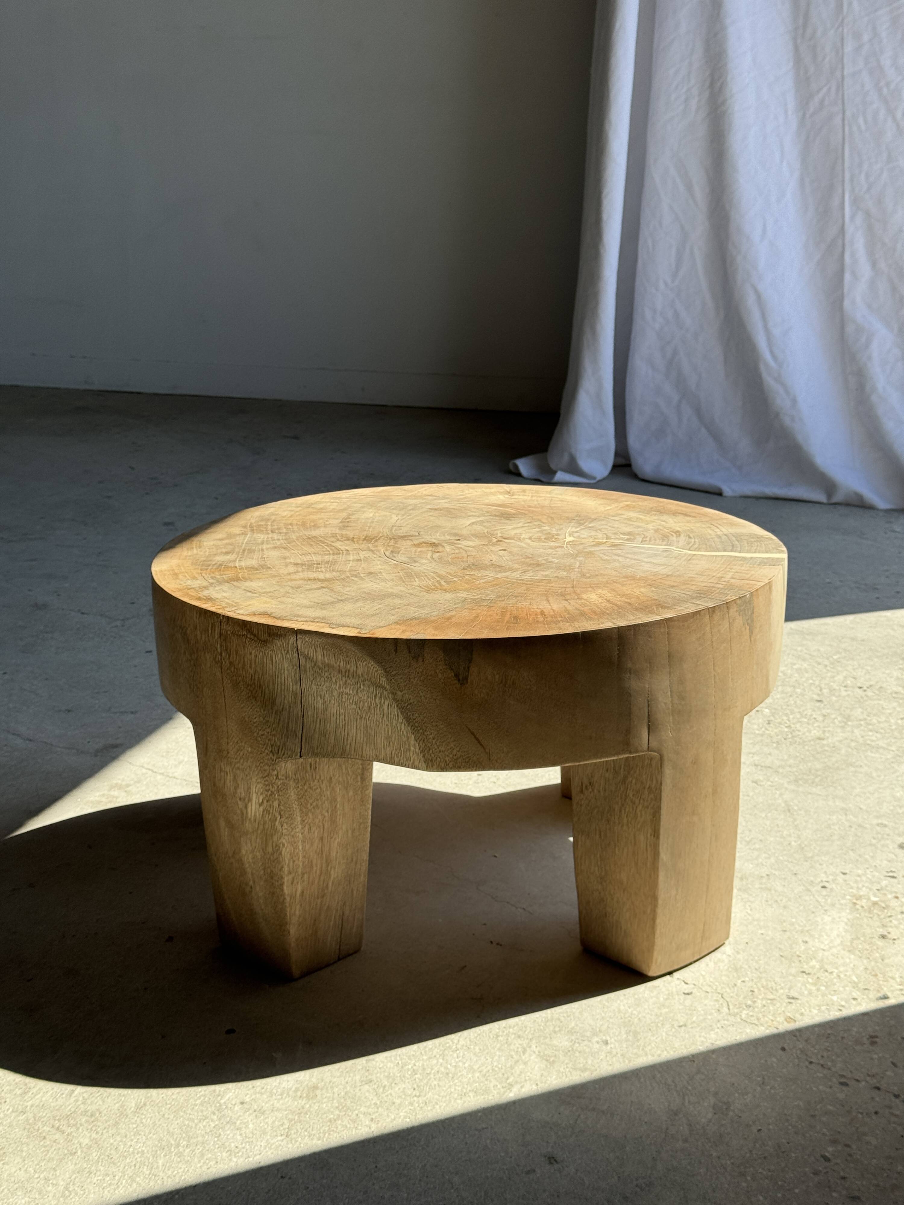 Coffee table, four-legged low table in natural solid monoxyle mango wood.