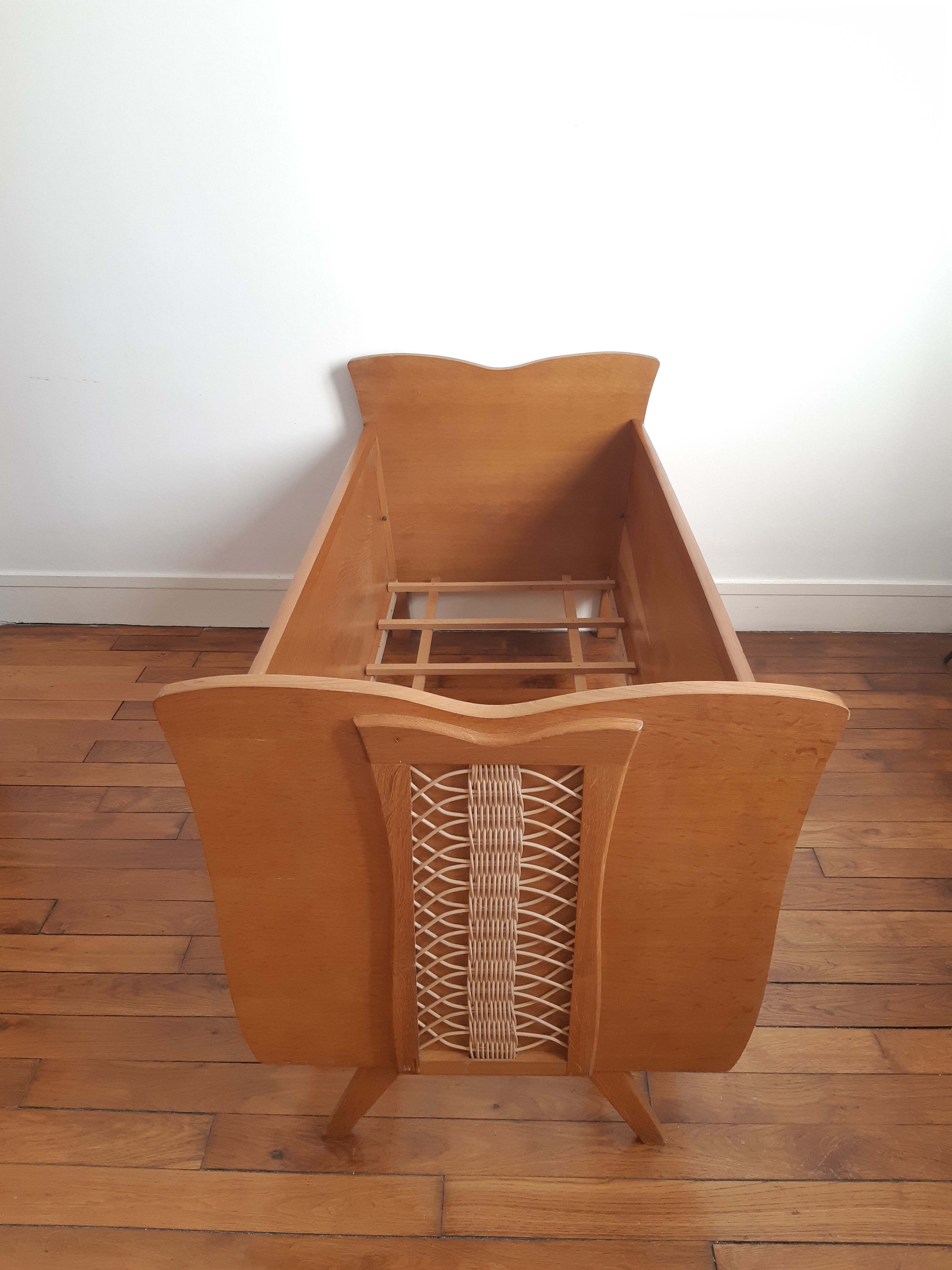 Wooden bed and vintage rattan