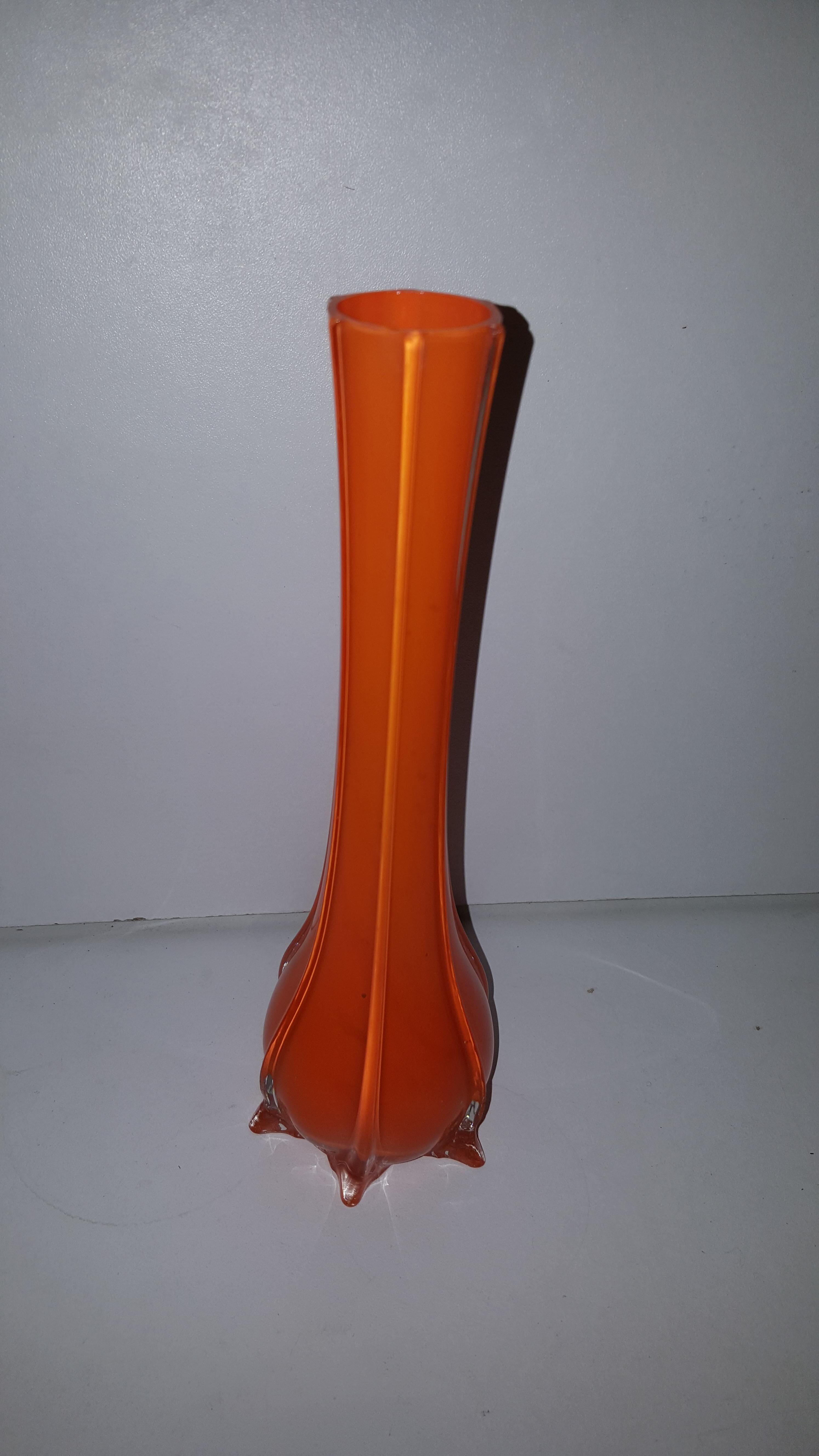 Doilies in glass vase orange vintage