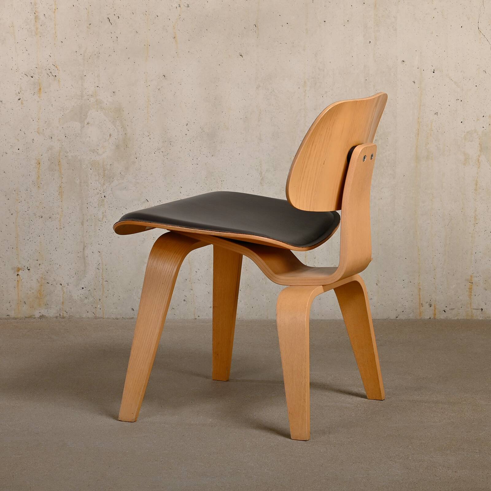 Charles & Ray Eames DCW Ash dining chair with Dark Brown Leather seat for Vitra