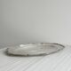 oval silver metal plate