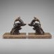 Art Deco bookends in patinated metal – animal pair – marble bases