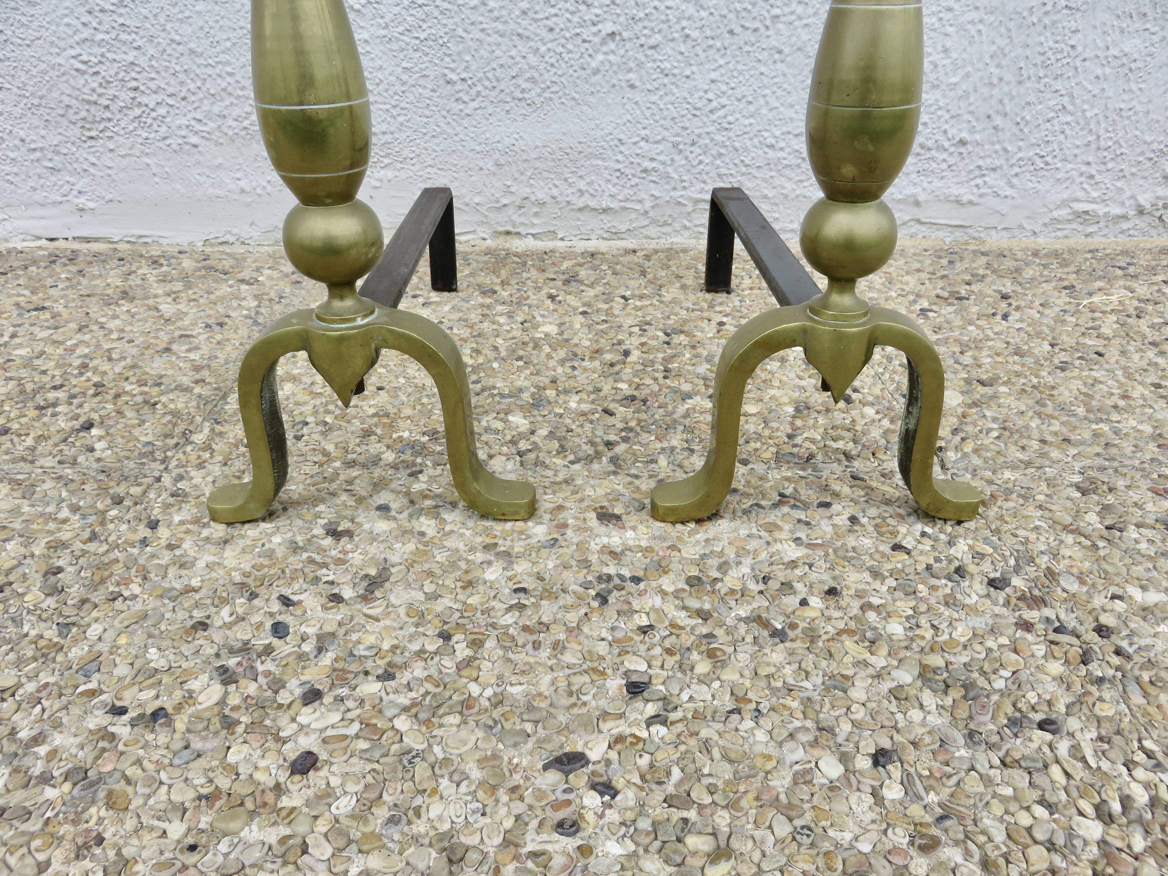 Pair of Neo-classical andirons, in solid bronze, 1920s-1930s.