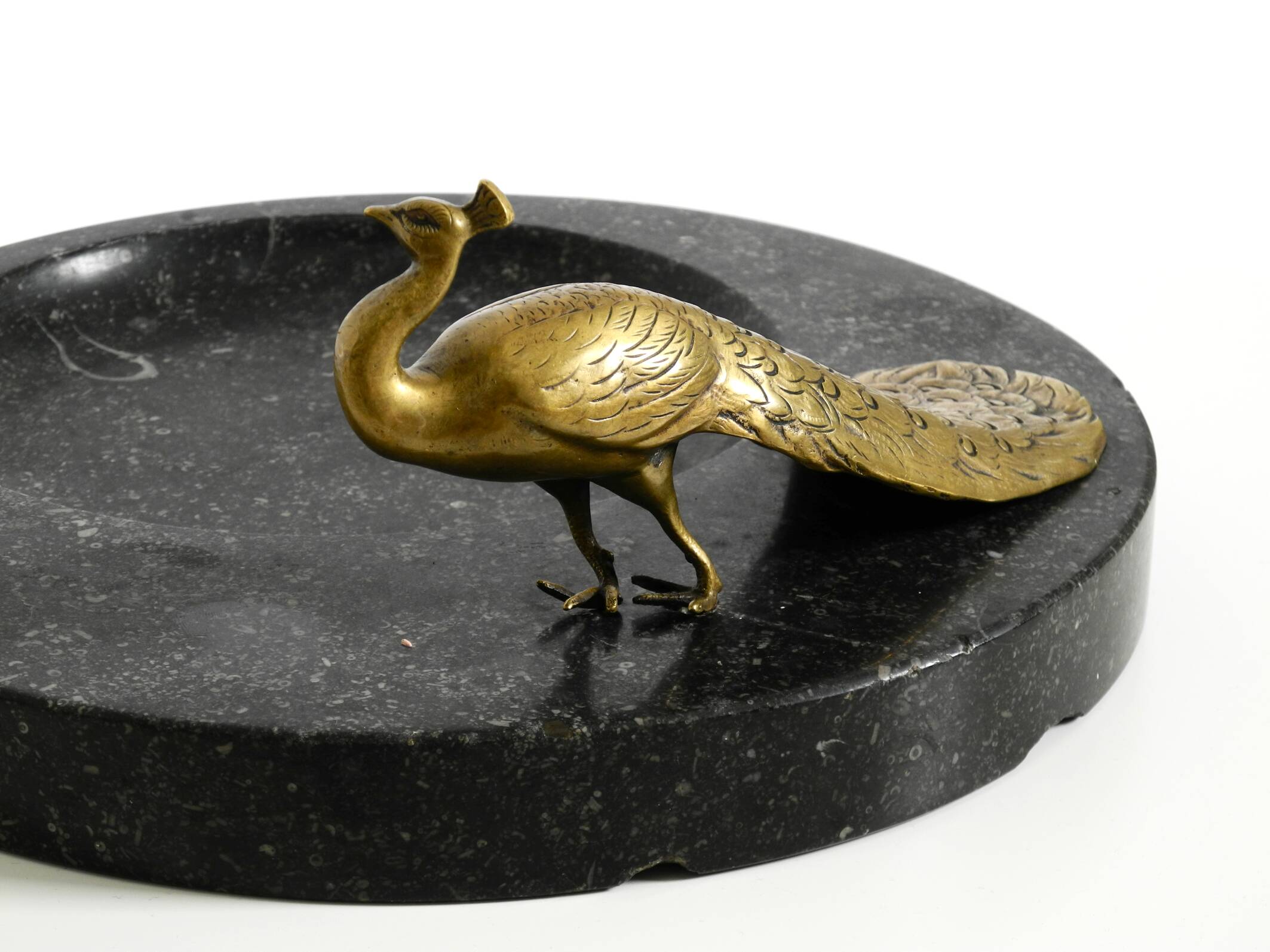 Beautiful, large black granite valet tray featuring a brass peacock, circa
