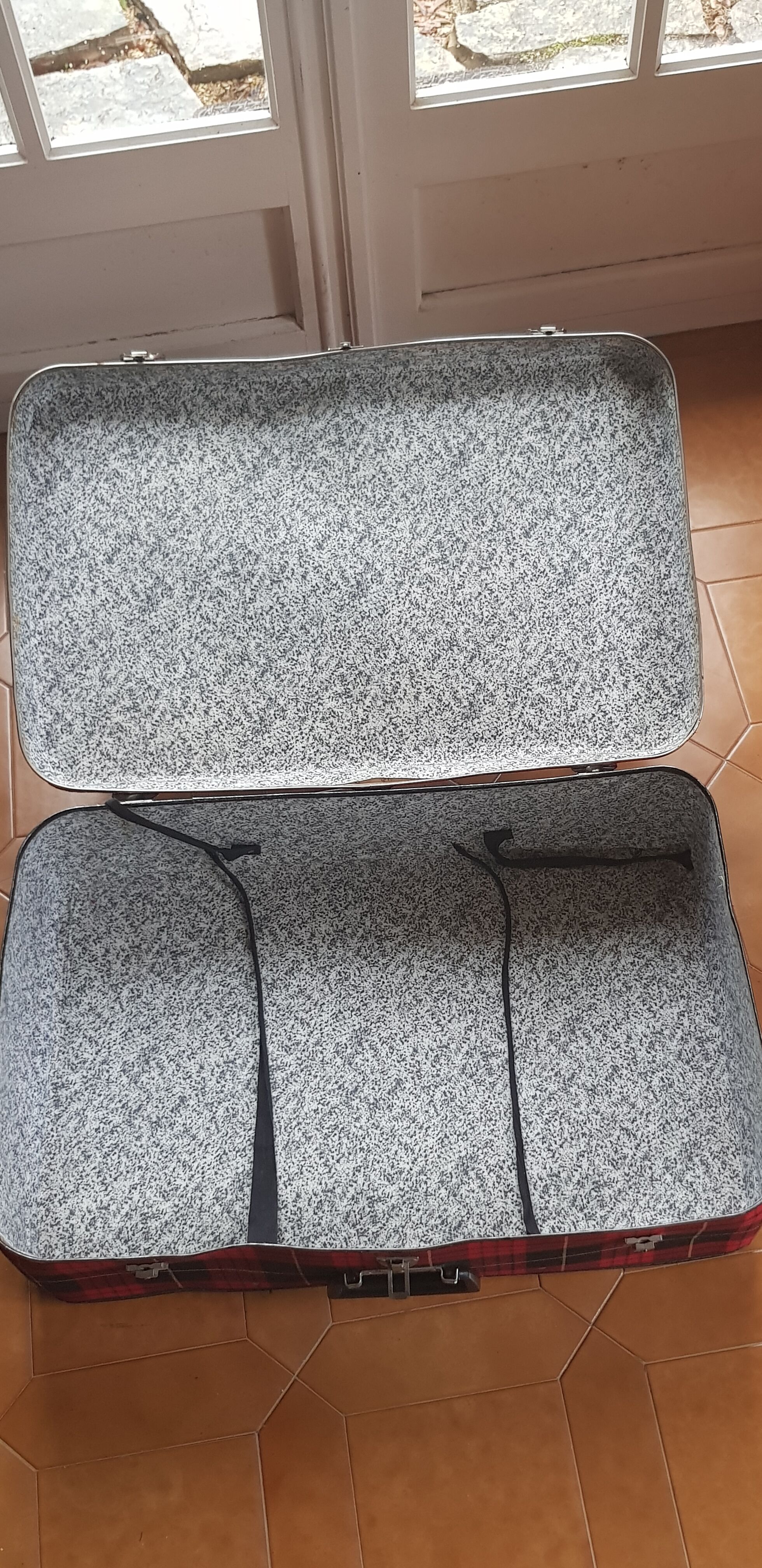 Vintage suitcase covered with scottish fabrics