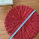 Vintage hourglass stool in red wicker or woven rattan.