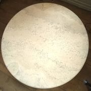 Round travertine coffee table, attributed to Angelo Mangiarotti, central cylindrical leg, 1970s