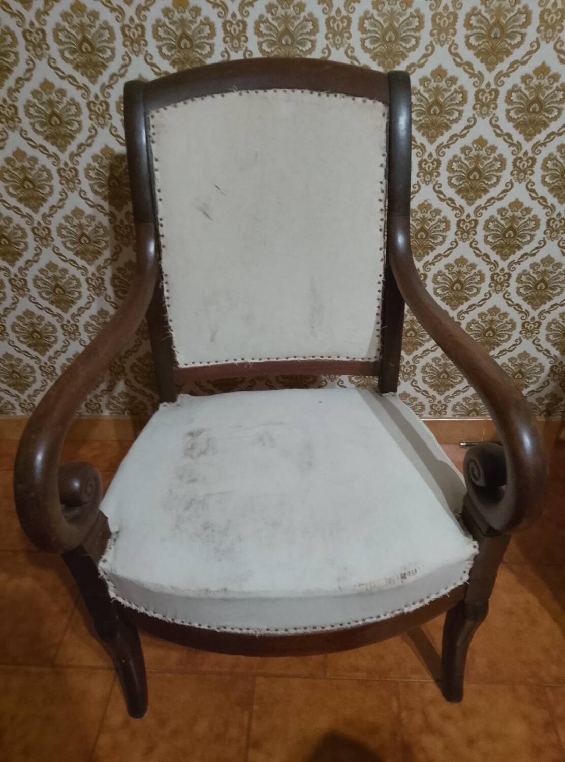 A pair of Empire period armchairs.