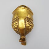 Old brass ashtray in the shape of a fish