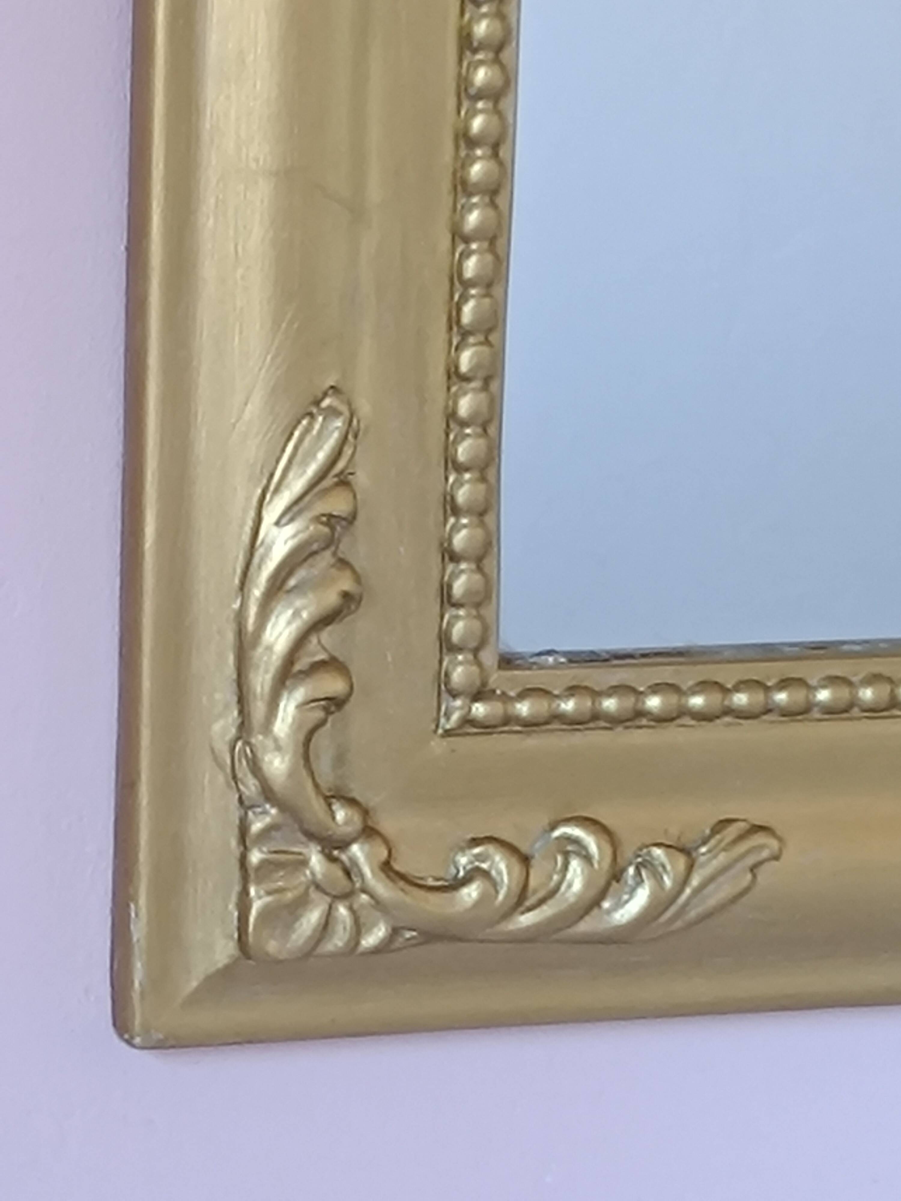 Gilded mirror with a Louis Philippe style pediment