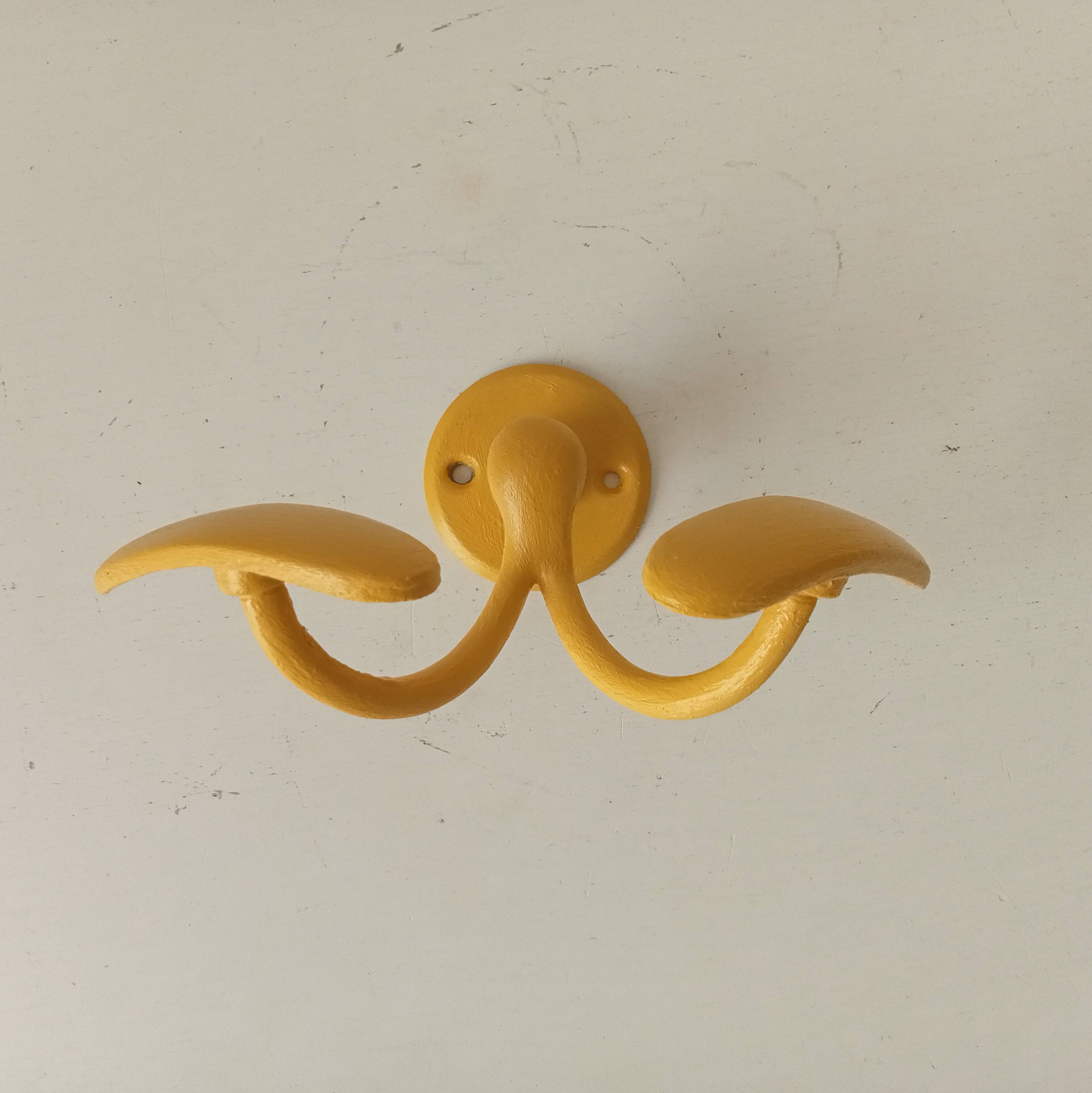 Vintage double coat rack in solid brass