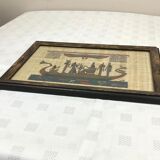 Egyptian papyrus under glass in wooden frame