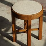 Mid-century Danish stool in oak, reupholstered in boucle wool, circa 1950.