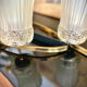 Table basse design vintage chrome et verre fumé noir sur roulettes