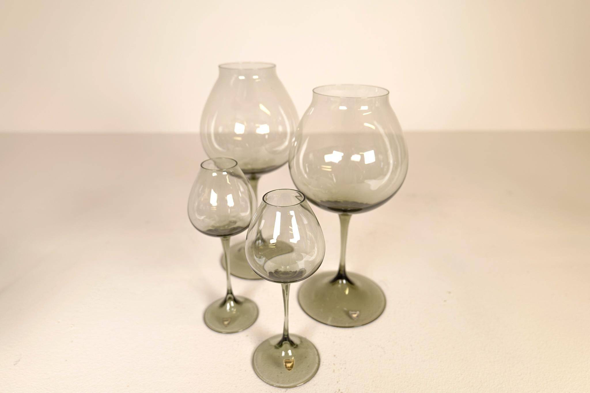 Large collection of Midcentury tulip glasses by Orrefors Nils Landberg, Sweden, 1950s.