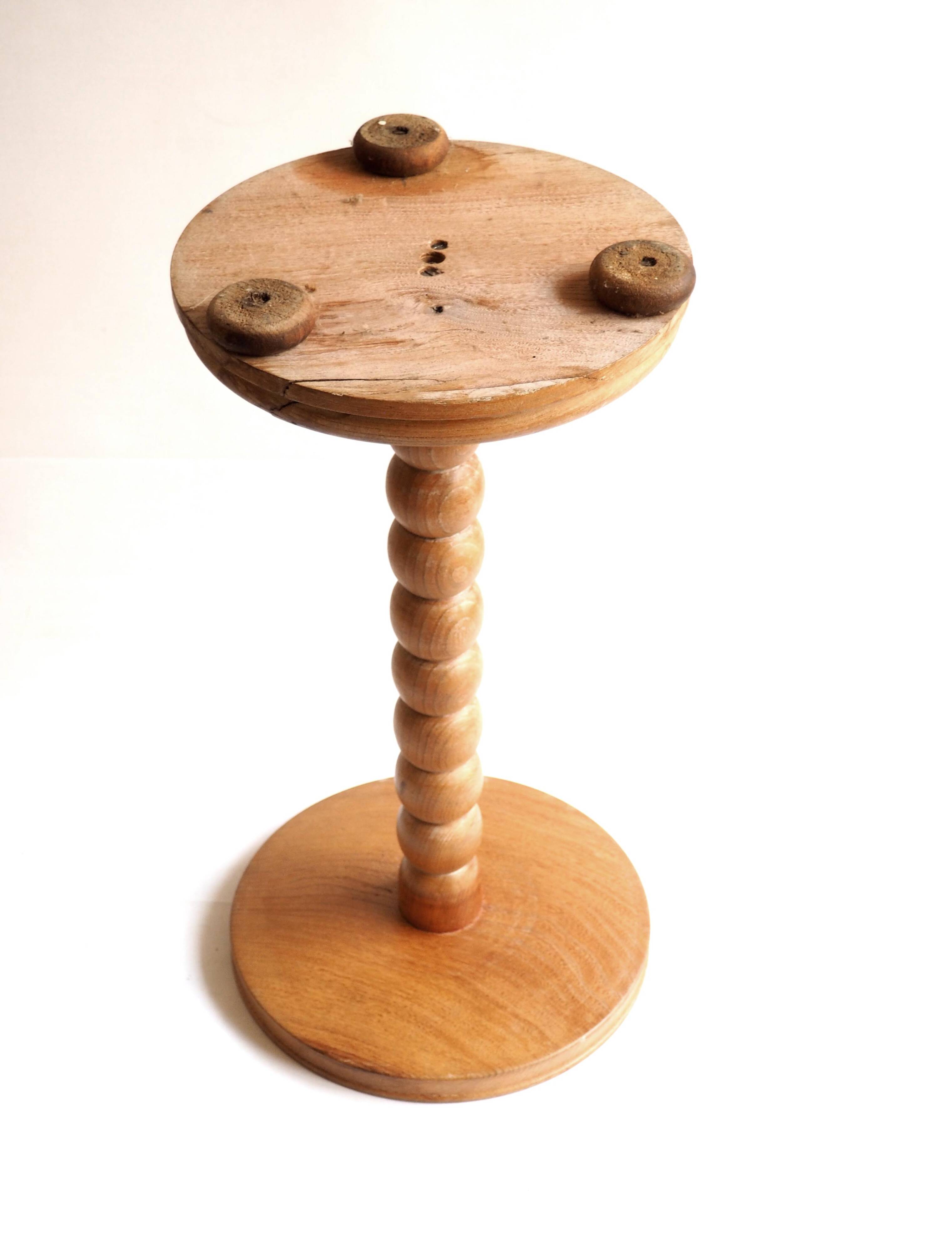 Beaded wood pedestal table