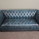 Chesterfield sofa buttoned in blue cowhide, 2.5 seats