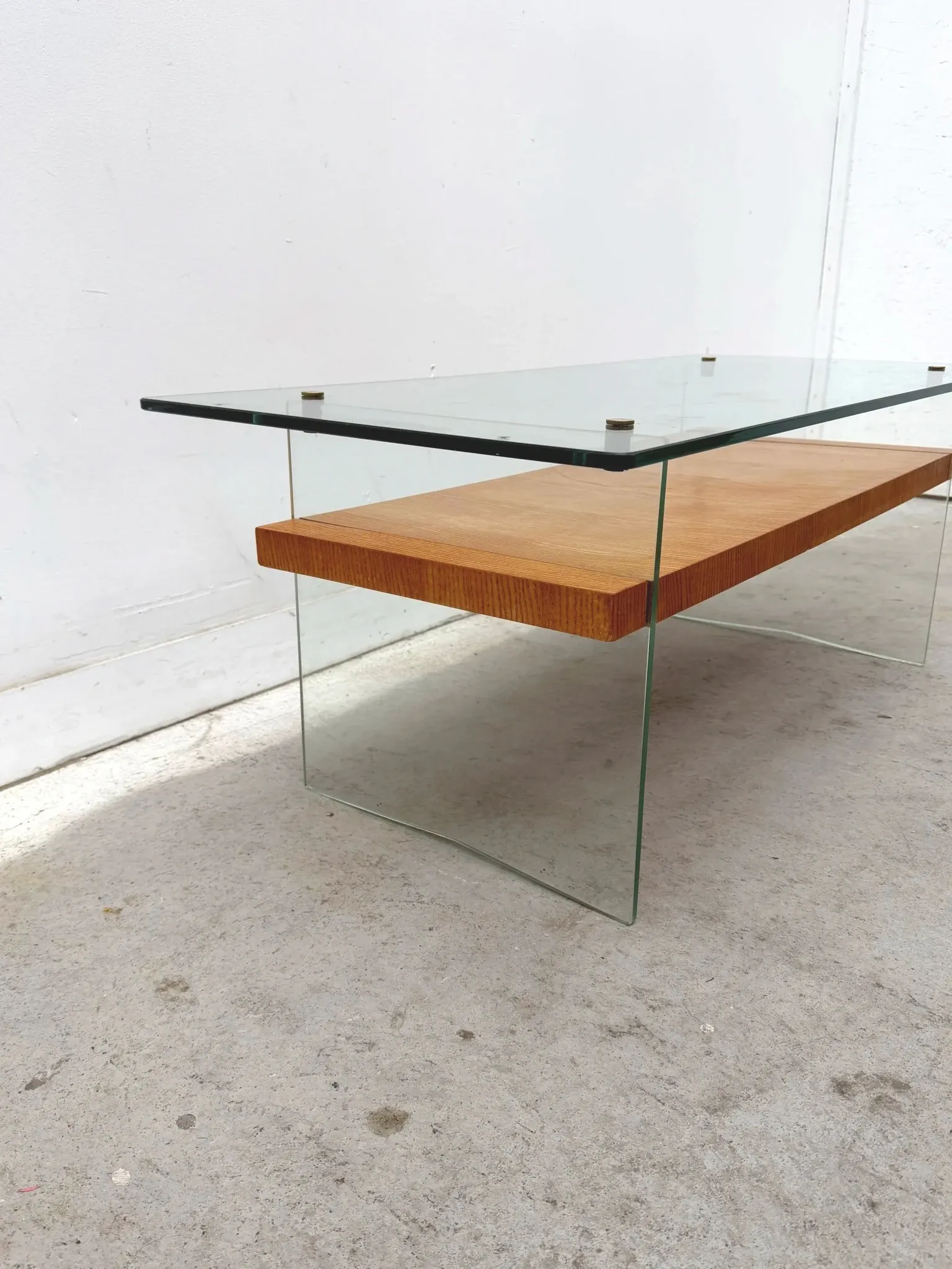 Coffee table by Robert Debiève in ash veneer, glass and brass, France 1950.