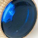 Blue blown glass vase and basketry