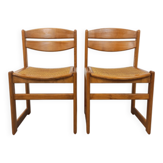 Paire de chaises traîneau vintage en bois de hêtre et cannage des années 70
