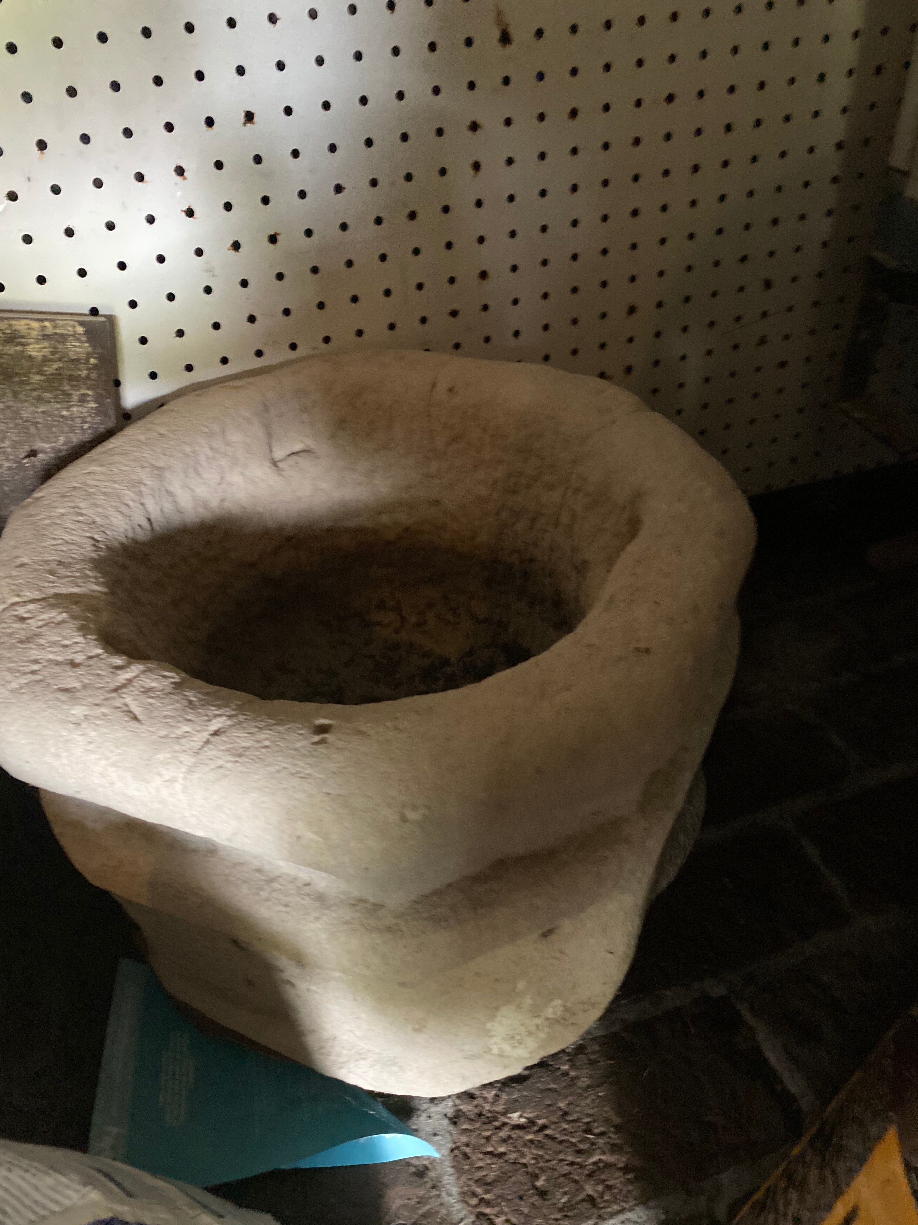 Ancient stone holy water font