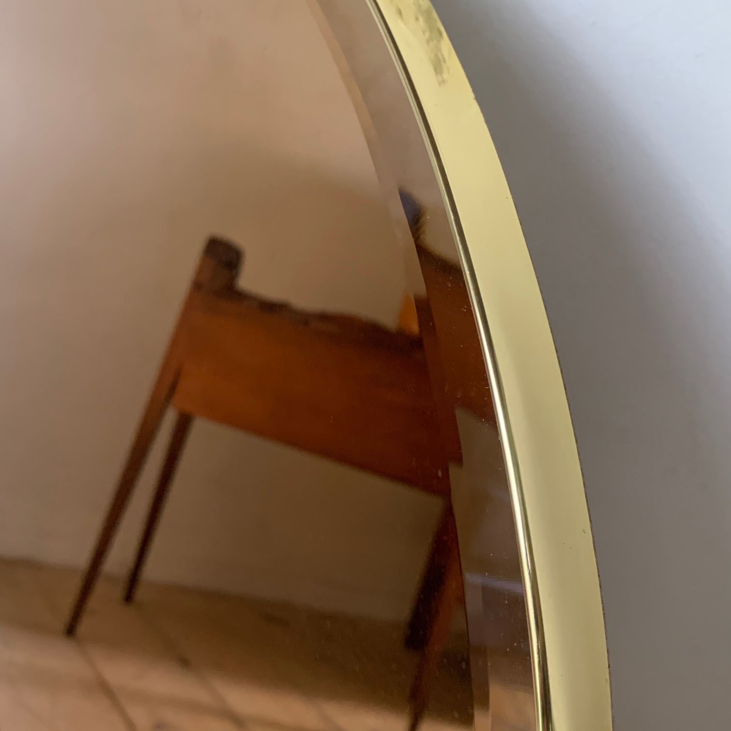 Vintage smoked oval wall mirror