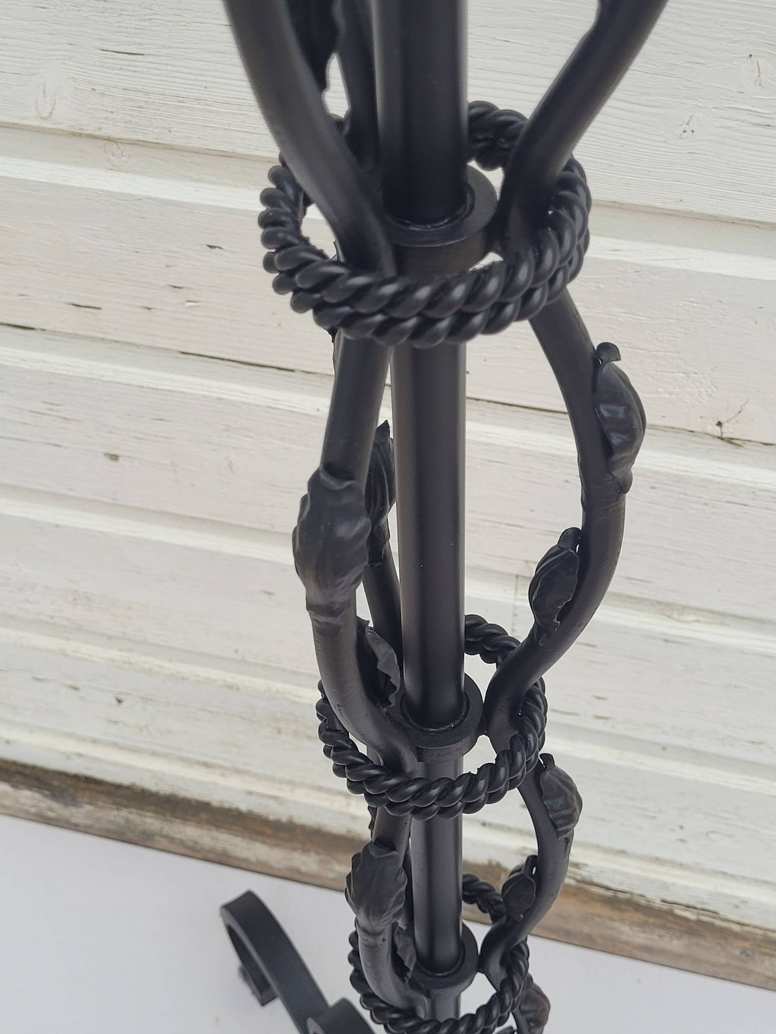 Black wrought iron floor lamp attributed to Gilbert Poillerat