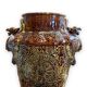 Important Longchamp Griffon vase in golden ceramic