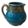 Old small Sadler cream pot in blue-green ceramic with a gold pattern, English milk jug.