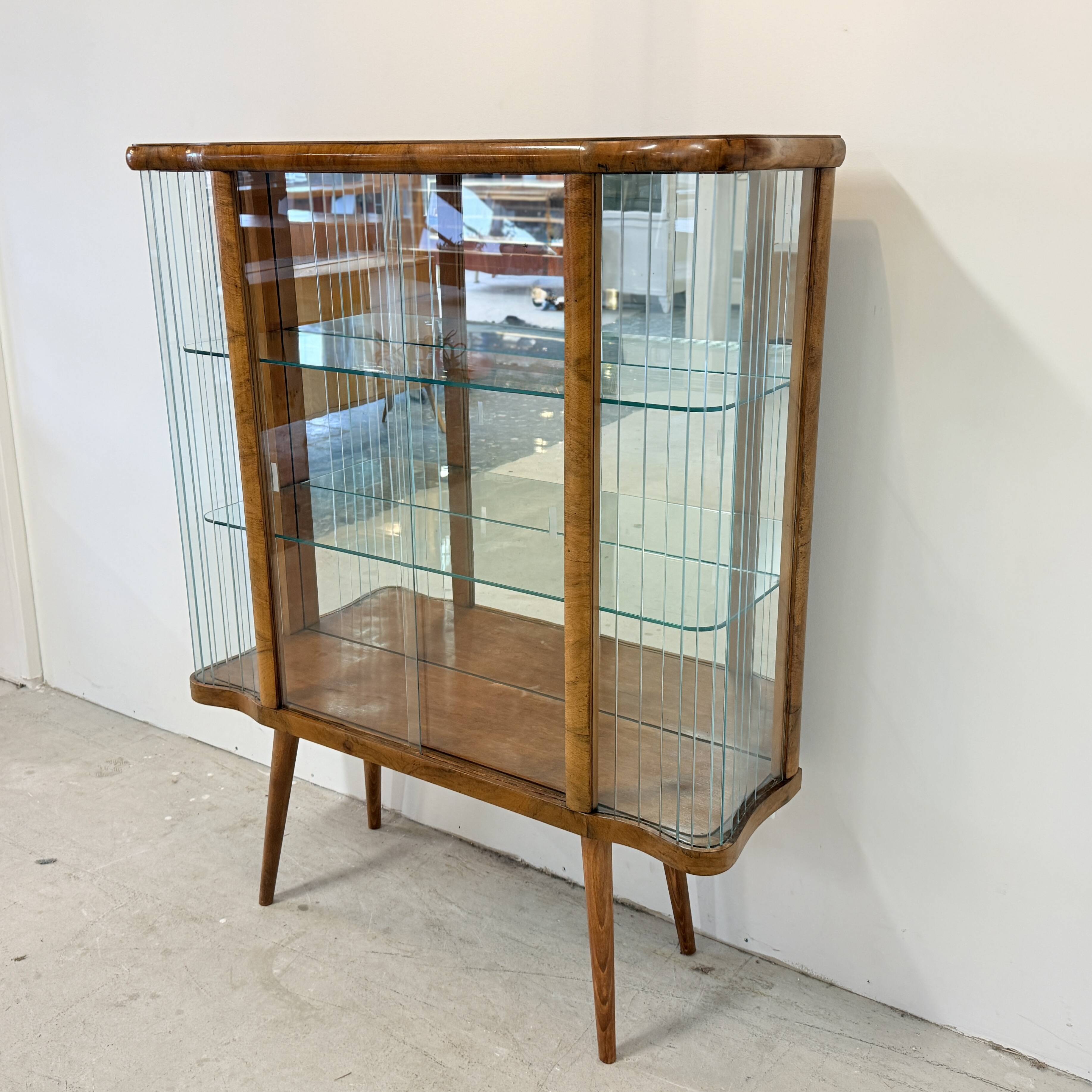 Elegant, curved display cabinet in Art Deco style