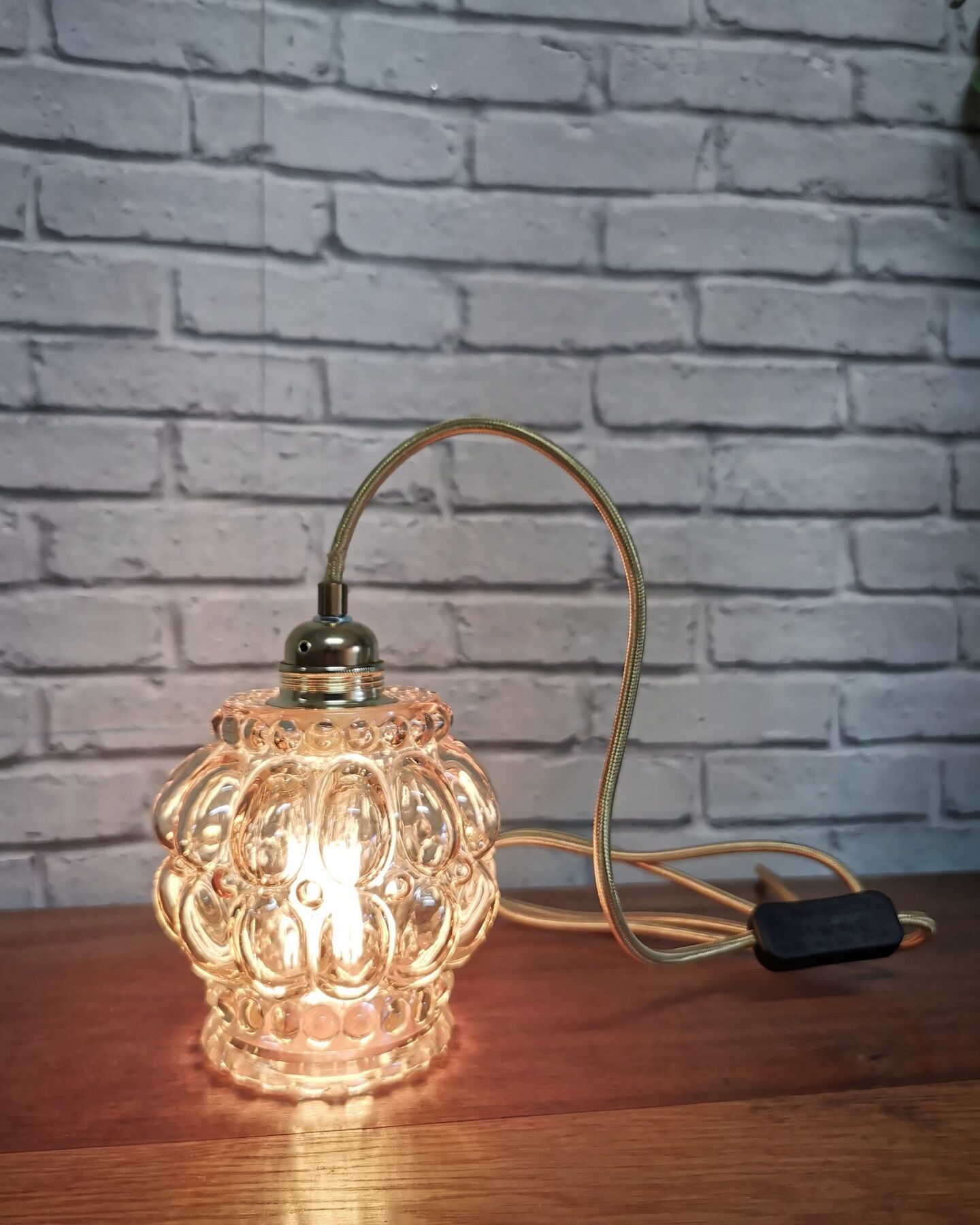 Old vintage hanging lamp stroller in moulded glass