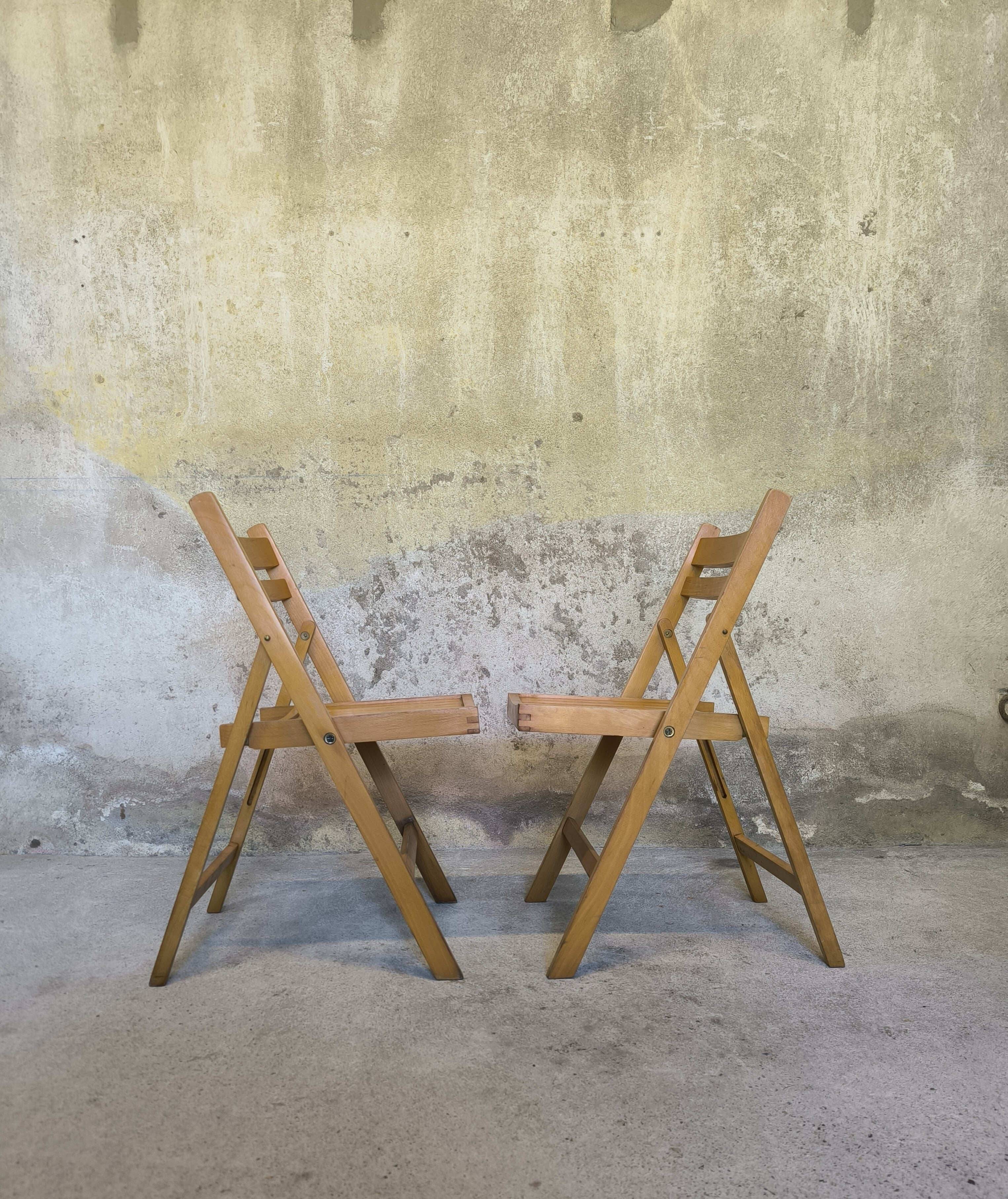 Pair of vintage folding wooden chairs