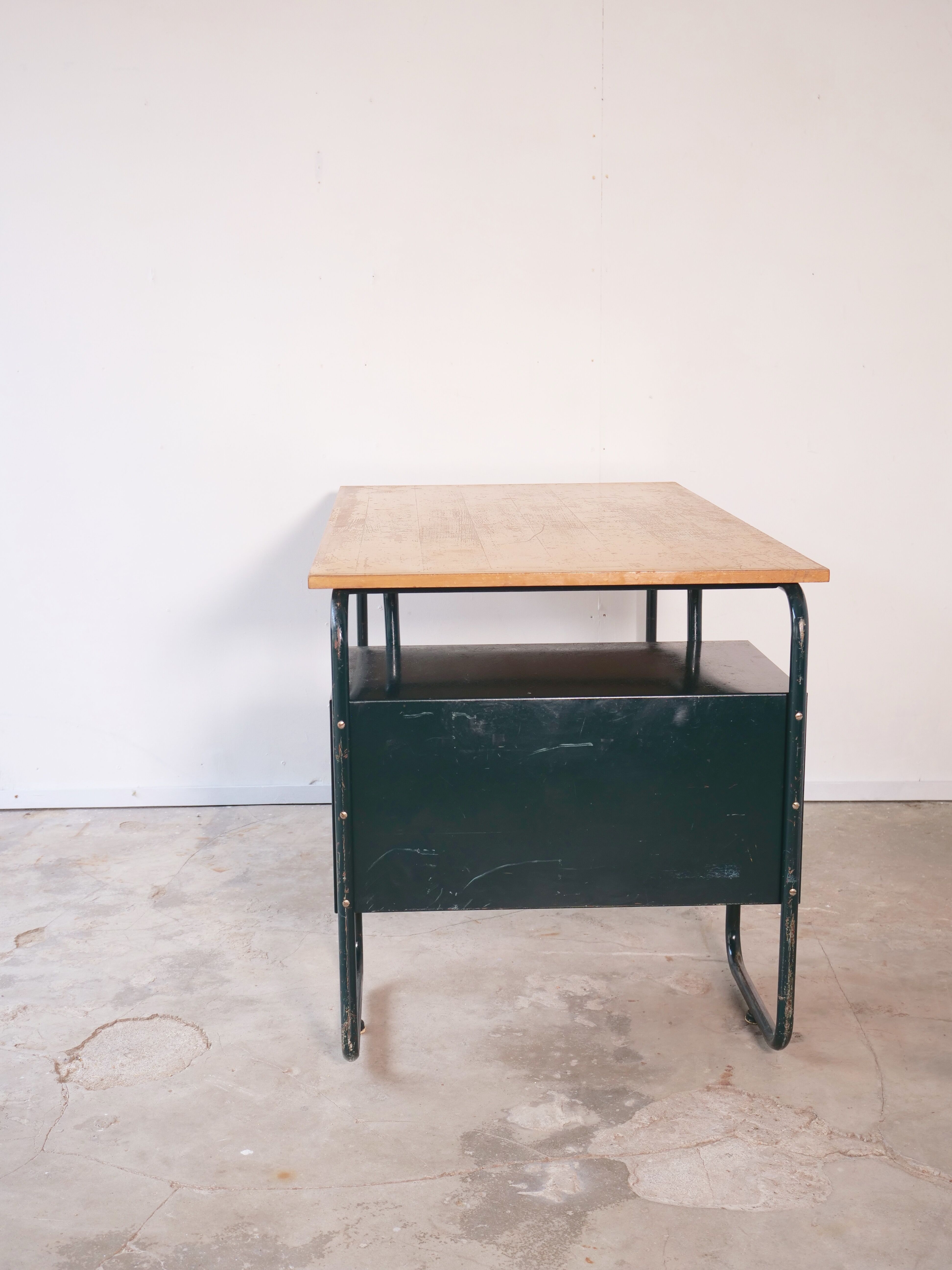 Desk with bauhaus style tubular steel chair