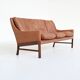 Canapé scandinave trois places en palissandre et cuir marron Danemark 1960