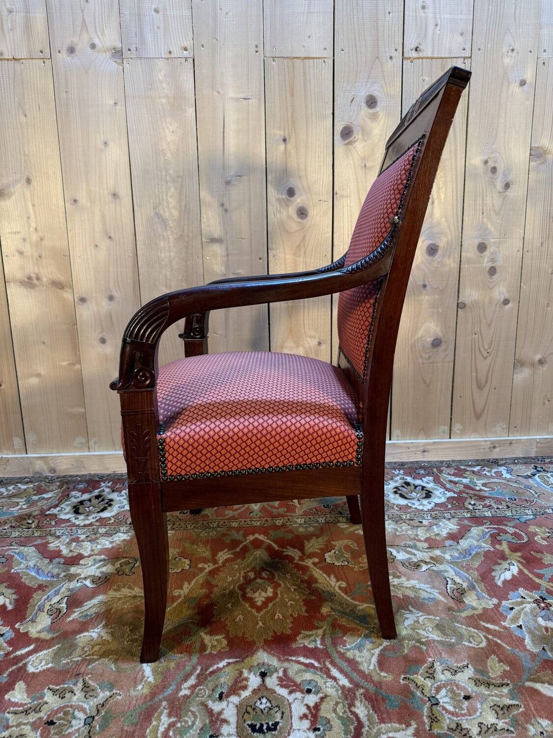 Empire period armchair in mahogany with saber legs.