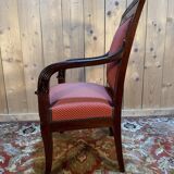 Empire period armchair in mahogany with saber legs.
