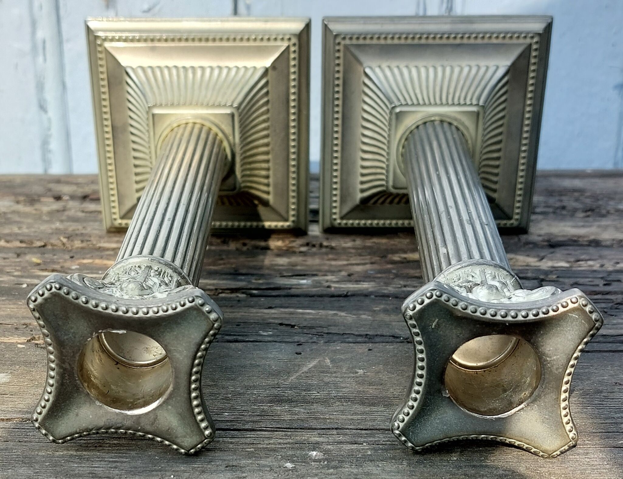 Duo of silver metal column candle holders