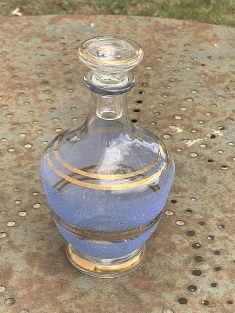 Blue granite glass carafe with vintage gold trim.