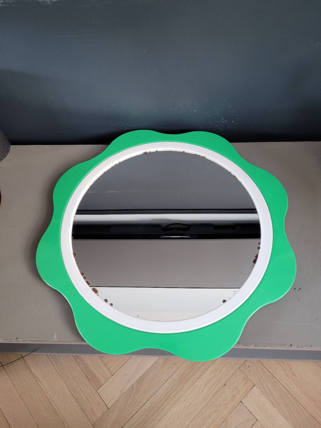 Plastic flower mirror by Finnish designer Makisen Kuvastin